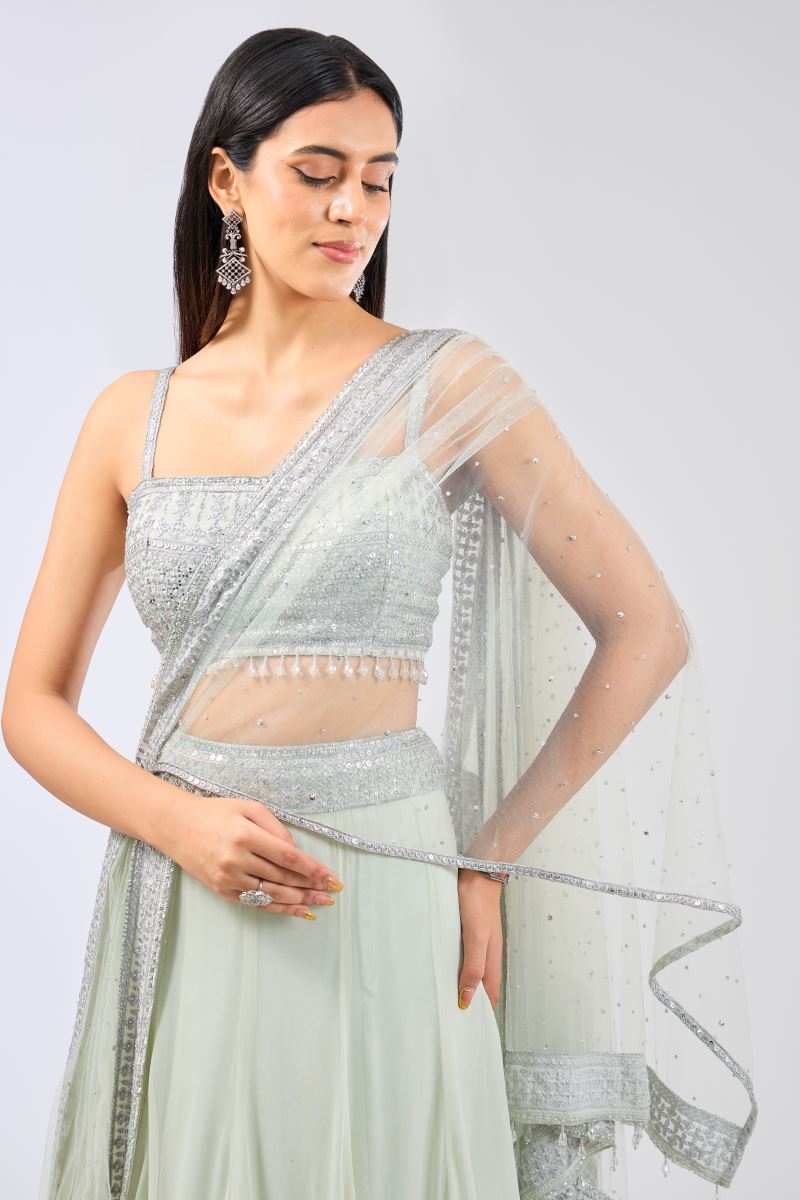 NADIA SAGE GREEN GEORGETTE  METAL THREAD JAAL LEHENGA WITH NET ATTACHED DRAPE AND BLOUSE