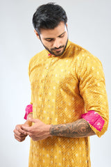 YELLOW ZARI  BOOTI AND SEQUIN BANDHANI KURTA WITH RANI  BANDHANI DETAILING AND COTTON SILK PANTS